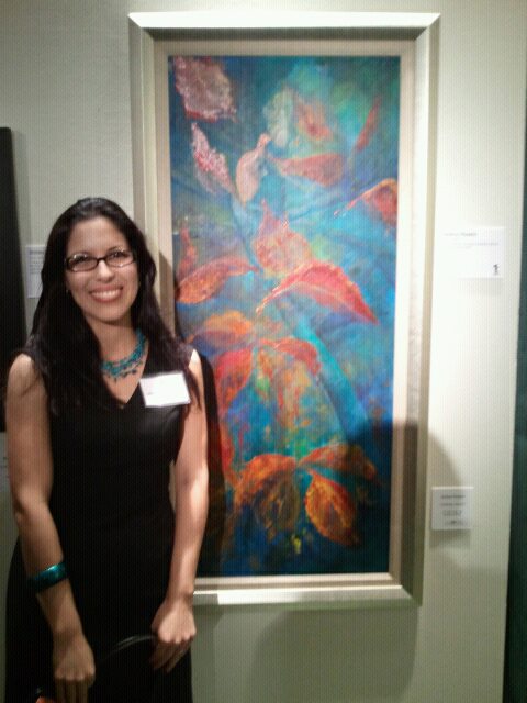 La vegabajeña Jessica Marie (Jimarie) Rosario Justicia, desde Kissimme con su pintura Caribbean Autumn