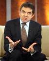 ROWAN ATKINSON COMO EL PRIMER MINISTRO GERARDO COLON